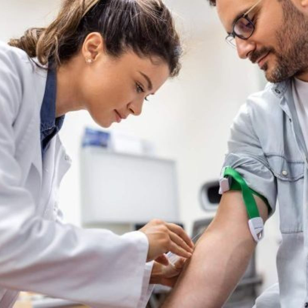 Medical professional drawing blood for testosterone libre test in clinical setting