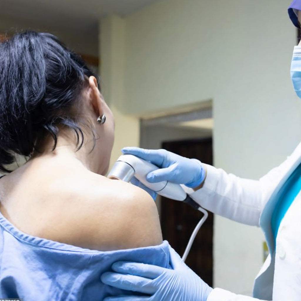 Ultrasound shoulder scan procedure showing non-invasive imaging of shoulder joint by medical professional